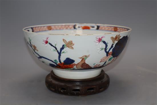 An 18th century Chinese verte Imari bowl on wood stand, c.1740, diameter 26cm